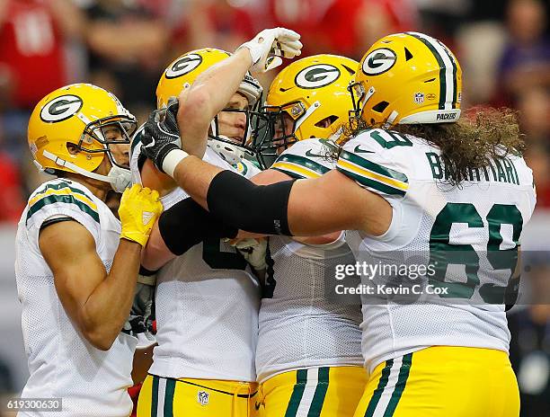 Jordy Nelson of the Green Bay Packers celebrates his touchdown reception against the Atlanta Falcons with Trevor Davis, T.J. Lang, and David...