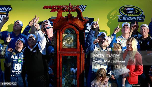 Jimmie Johnson, driver of the Lowe's Chevrolet, his family, Jeff Gordon, driver of the Nationwide Chevrolet, and Rick Hendrick celebrate in Victory...