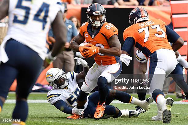 Demaryius Thomas of the Denver Broncos shakes a tackled attempt by Jatavis Brown of the San Diego Chargers during the first quarter on Sunday,...