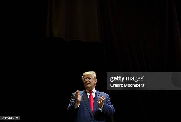 Donald Trump, 2016 Republican presidential nominee, applauds before speaking at a campaign rally at the Venetian Hotel and Casino in Las Vegas,...