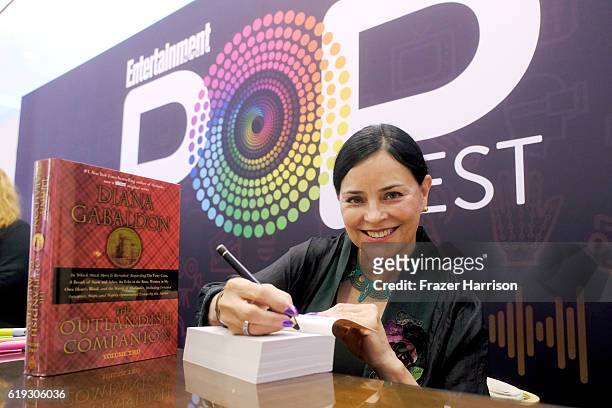 Author Diana Gabaldon signs books during Entertainment Weekly's PopFest at The Reef on October 30, 2016 in Los Angeles, California.