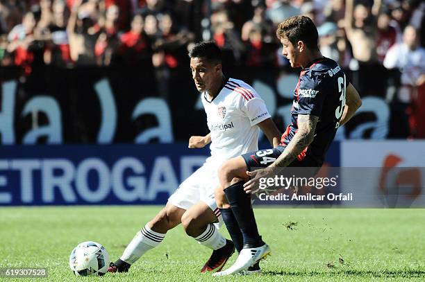 Marcos Senesi of San Lorenzo and Joaquin Torres of Newell's Old Boys fight for the ball during a match between Newell's Old Boys and San Lorenzo as...