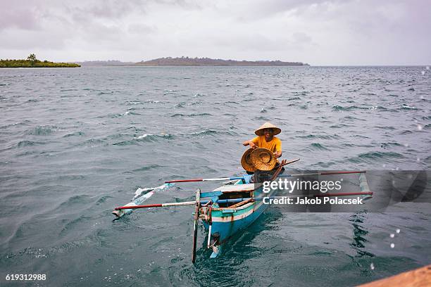 small fisher boat in the telos islands - indonesia mentawai canoe stock pictures, royalty-free photos & images