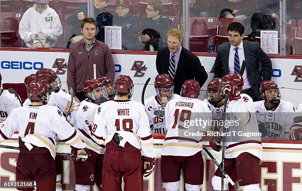 Associate Coach Greg Brown of the Boston College Eagles stands behind the bench as he fills-in for head coach Jerry York who is recovering from eye...