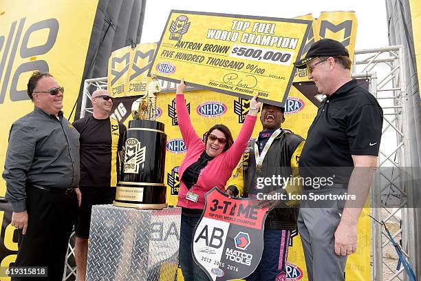 Antron Brown Don Schumacher Racing NHRA Top Fuel Dragster and his wife Billie Jo Brown celebrate clinching the NHRA Top Fuel championship during the...