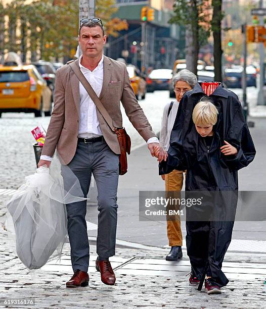 Liev Schreiber and children Samuel and Alexander go trick or treating on October 30, 2016 in New York City.