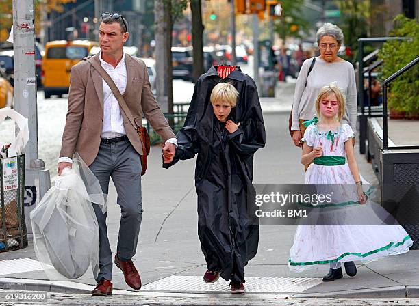 Liev Schreiber and children Samuel and Alexander go trick or treating on October 30, 2016 in New York City.