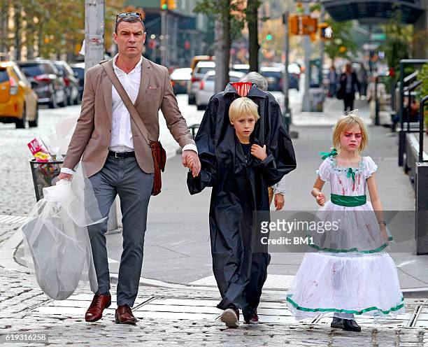 Liev Schreiber and children Samuel and Alexander go trick or treating on October 30, 2016 in New York City.