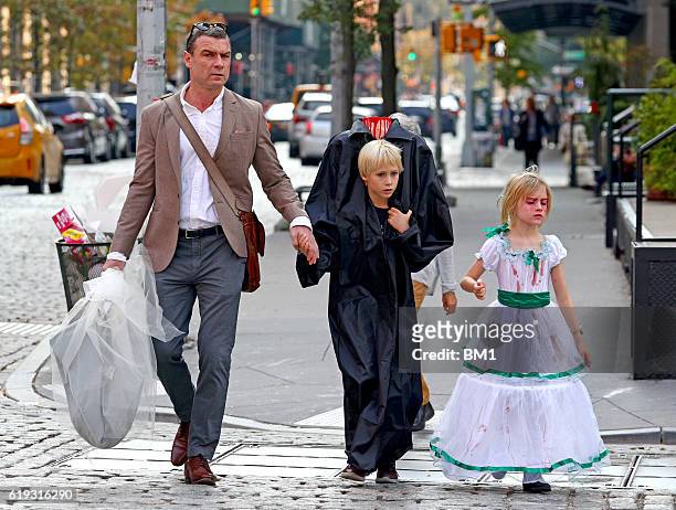 Liev Schreiber and children Samuel and Alexander go trick or treating on October 30, 2016 in New York City.