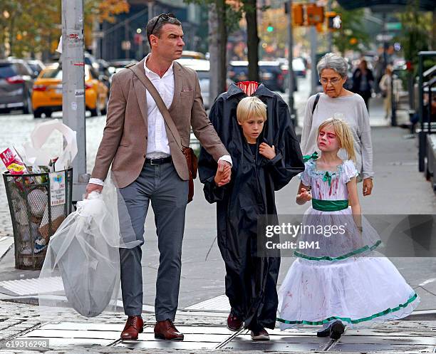 Liev Schreiber and children Samuel and Alexander go trick or treating on October 30, 2016 in New York City.