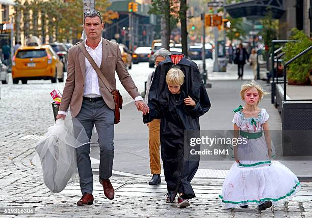 Liev Schreiber and children Samuel and Alexander go trick or treating on October 30, 2016 in New York City.