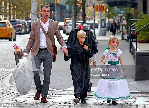 Liev Schreiber and children Samuel and Alexander go trick or treating on October 30, 2016 in New York City.