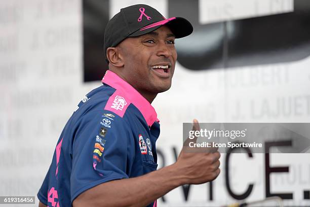 Antron Brown Don Schumacher Racing NHRA Top Fuel Dragster gives a thumbs up to a fan after his first run during the NHRA Toyota Nationals Sunday,...