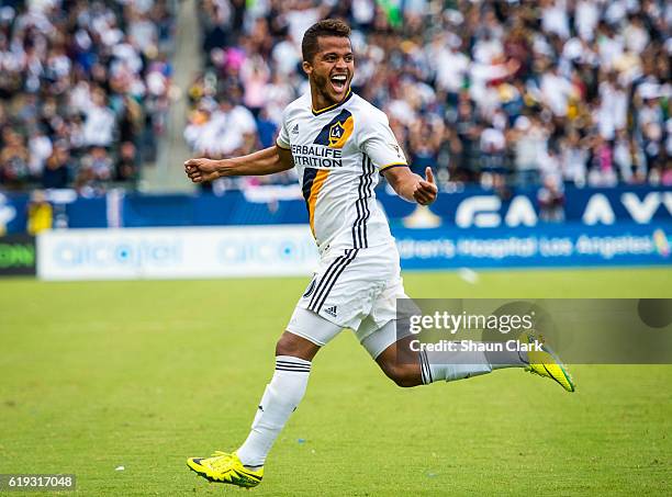 Giovani dos Santos of Los Angeles Galaxy celebrates his game winning goal during Los Angeles Galaxy's MLS Playoff Semifinal match against Colorado...