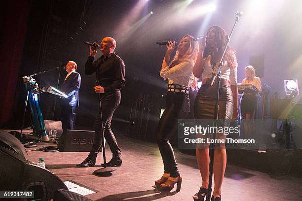 Martyn Ware, Glenn Gregory, Kelly Barnes and Rachel Mosleh of Heaven 17 perform at O2 Shepherd's Bush Empire on October 30, 2016 in London, England.