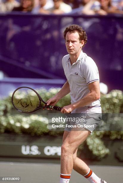 John McEnroe of the United States in action during a match in the Men's 1985 US Open Tennis Championships circa 1985 at the National Tennis Center in...