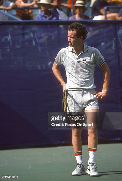 John McEnroe of the United States reacts during a match in the Men's 1985 US Open Tennis Championships circa 1985 at the National Tennis Center in...