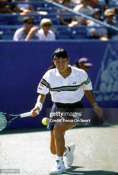 Tennis player Kimiko Date-Krumm of Japan hits a return during the women 1995 U.S. Open Tennis Tournament circa 1995 at the USTA National Tennis...