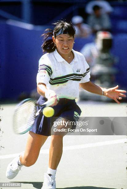 Tennis player Kimiko Date-Krumm of Japan hits a return during the women 1995 U.S. Open Tennis Tournament circa 1995 at the USTA National Tennis...