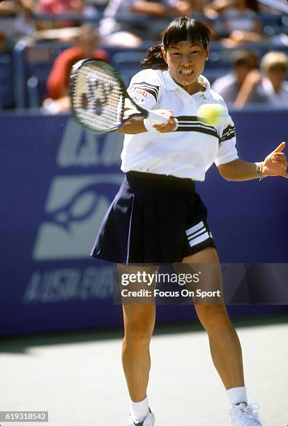Tennis player Kimiko Date-Krumm of Japan hits a return during the women 1995 U.S. Open Tennis Tournament circa 1995 at the USTA National Tennis...