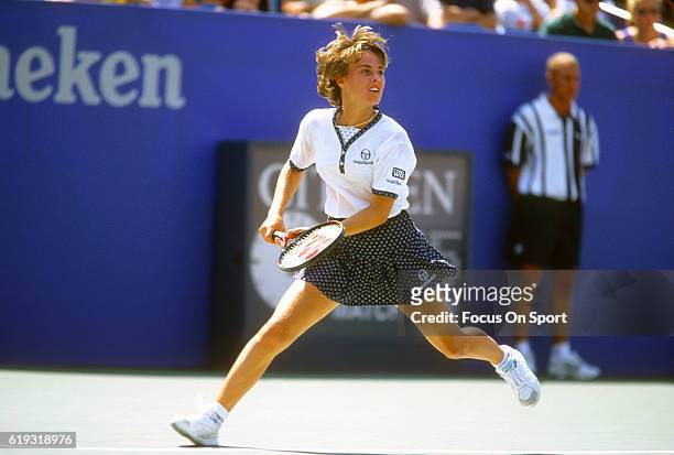 Tennis player Martina Hingis of Switzerland in action during the women 1996 U.S. Open Tennis Tournament circa 1996 at the USTA National Tennis Center...