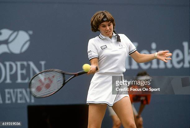 Tennis player Martina Hingis of Switzerland hits a return against Venus Williams during the women 1997 U.S. Open Tennis Tournament September 6, 1997...