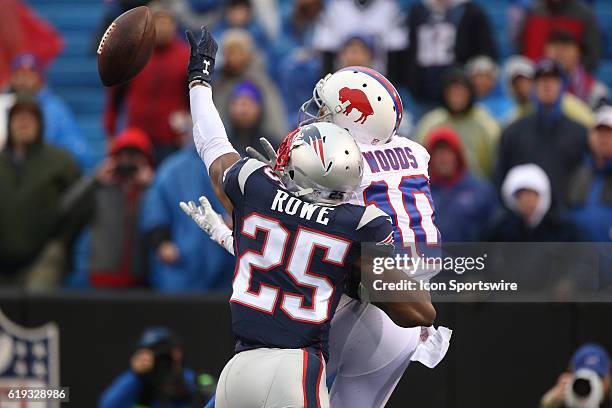 New England Patriots cornerback Eric Rowe bats down a football intended for Buffalo Bills wide receiver Robert Woods during a NFL game between the...