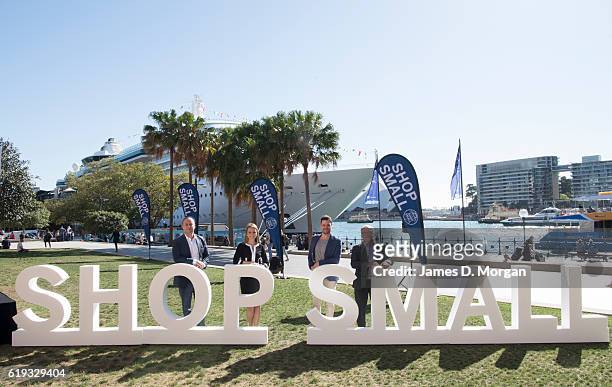 Staff from American Express pose for photographs by the Shop Small letters during the Shop Small 2016 launch event at Museum of Contemporary Art on...