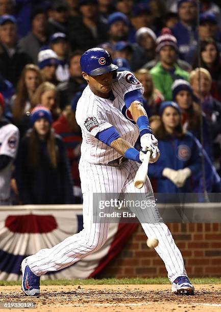 Addison Russell of the Chicago Cubs hits a single in the fourth inning against the Cleveland Indians in Game Five of the 2016 World Series at Wrigley...