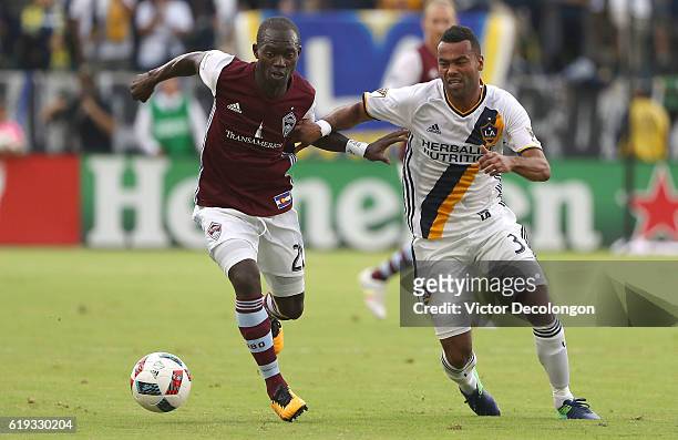 Michael Azira of Colorado Rapids and Ashley Cole of Los Angeles Galaxy vie for the ball during the first half of leg one of the Audi 2016 MLS Cup...