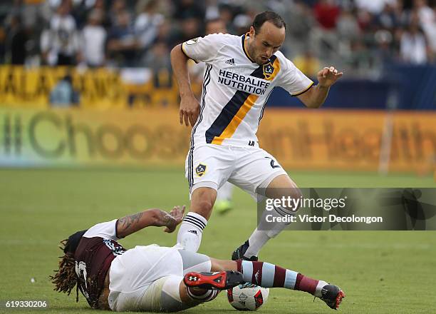 Jermaine Jones of Colorado Rapids slides to play the ball away from Landon Donovan of Los Angeles Galaxy during the second half of leg one of the...