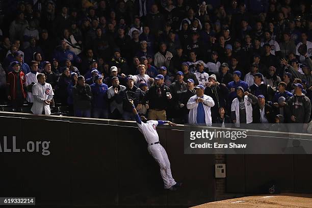 Jason Heyward of the Chicago Cubs catches a foul ball in the third inning against the Cleveland Indians in Game Five of the 2016 World Series at...