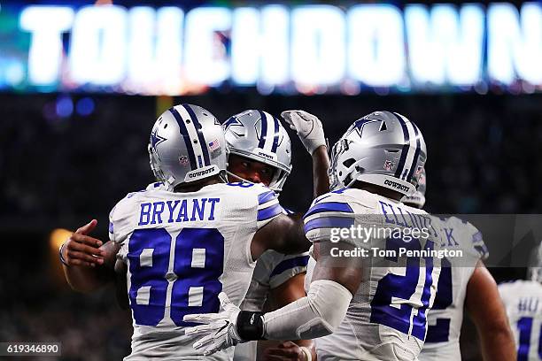 Dak Prescott of the Dallas Cowboys celebrates with Dez Bryant after scoring in the fourth quarter during a game between the Dallas Cowboys and the...