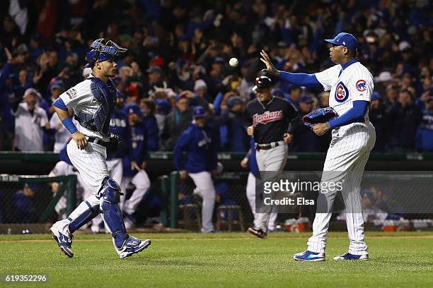 Willson Contreras of the Chicago Cubs and Aroldis Chapman celebrate after beating the Cleveland Indians 3-2 in Game Five of the 2016 World Series at...