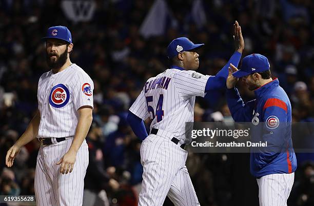 Jake Arrieta and Aroldis Chapman of the Chicago Cubs celebrate after beating the Cleveland Indians 3-2 in Game Five of the 2016 World Series at...