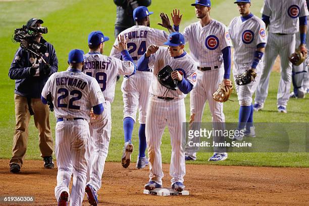 The Chicago Cubs celebrate after beating the Cleveland Indians 3-2 in Game Five of the 2016 World Series at Wrigley Field on October 30, 2016 in...