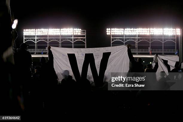 Fans celebrate after the Chicago Cubs beat the Cleveland Indians 3-2 in Game Five of the 2016 World Series at Wrigley Field on October 30, 2016 in...