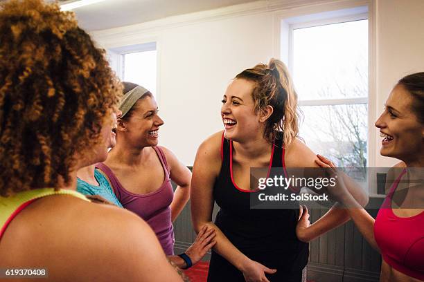 group of friends talking after fitness class - gym friends stock pictures, royalty-free photos & images