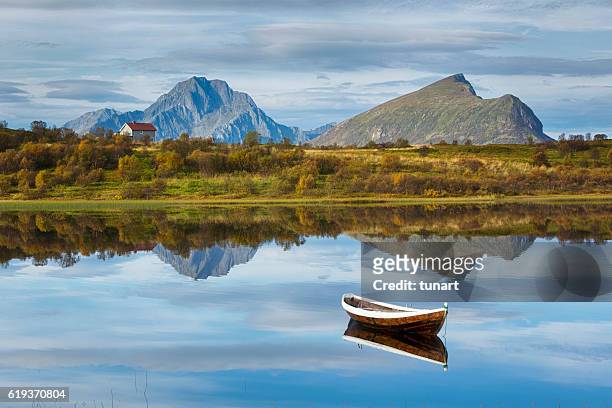 boat and lake in lofoten, norway - autumn norway stock pictures, royalty-free photos & images