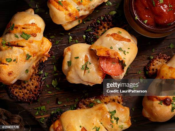 mini pepperoni stromboli bites - salami stock pictures, royalty-free photos & images