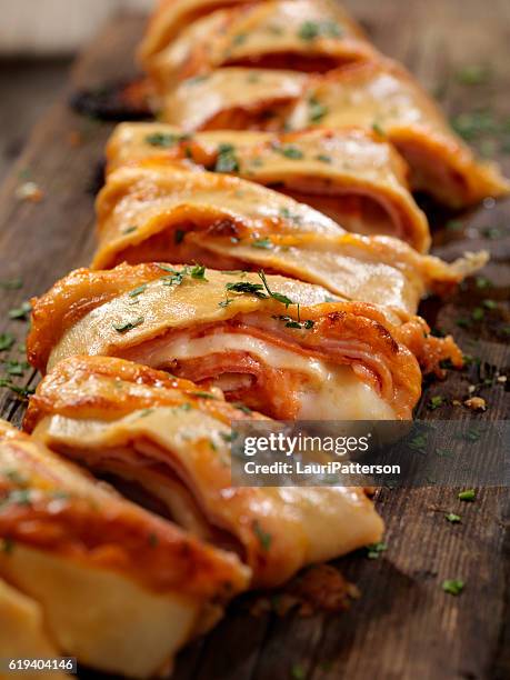 stromboli with pepperoni, ham and salami - strudel stock pictures, royalty-free photos & images