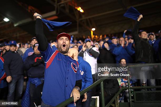 Fans cheer during Game Five of the 2016 World Series between the Chicago Cubs and the Cleveland Indians at Wrigley Field on October 30, 2016 in...