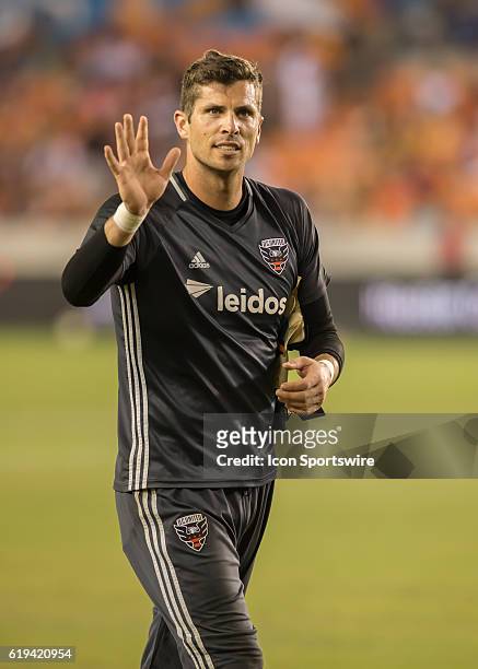 Former Houston Dynamo and now D.C. United goalkeeper Tally Hall waves to fans during the MLS soccer match between DC United and Houston Dynamo at...