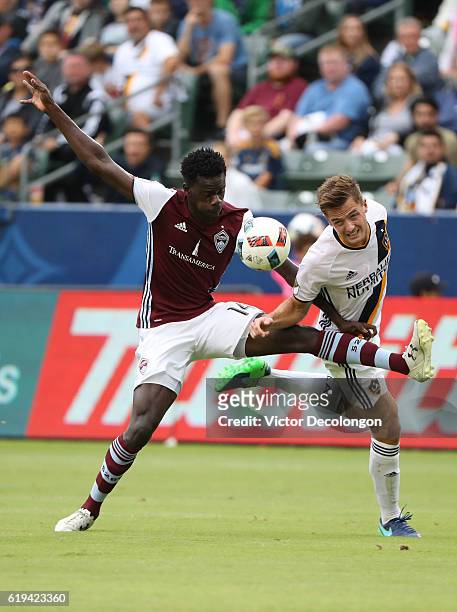 Dominique Badji of the Colorado Rapids and Robbie Rogers of the Los Angeles Galaxy vie or the ball during the first half of leg one of the Audi 2016...