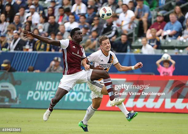 Dominique Badji of the Colorado Rapids and Robbie Rogers of the Los Angeles Galaxy vie or the ball during the first half of leg one of the Audi 2016...