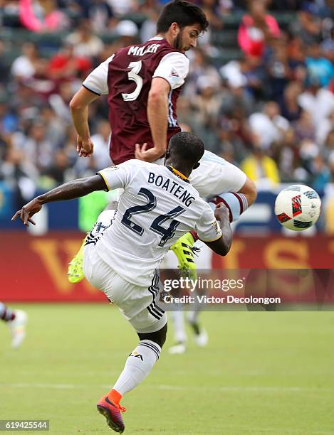 Ema Boateng of Los Angeles Galaxy and Eric Miller of Colorado Rapids vie for the ball during leg one of the Audi 2016 MLS Cup Playoff Western...