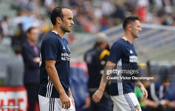 Landon Donovan, left, and Robbie Keane of Los Angeles Galaxy look on during warm-up prior to leg one of the Audi 2016 MLS Cup Playoff Western...