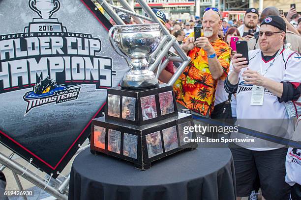 Fans take photos of the Calder Cup as the Monsters and their fans celebrate their 2016 Calder Cup Championship at the Gateway Plaza in Cleveland, OH.