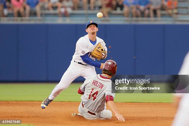 S Deacon Liput forces out USF's Tyler Holton and then Liput makes the throw over to first base to complete the double play during the NCAA Super...