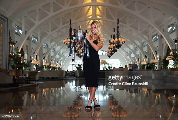 Champion Dominika Cibulkova of Slovakia poses with the Billie Jean King trophy after her victory against Angelique Kerber of Germany at Clifford Pier...
